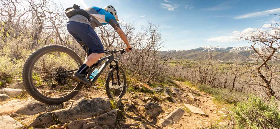 Man riding his mountain bike in Park City during summer